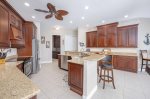 Large Kitchen with Stainless Steel Appliances and Wrap Around Bar